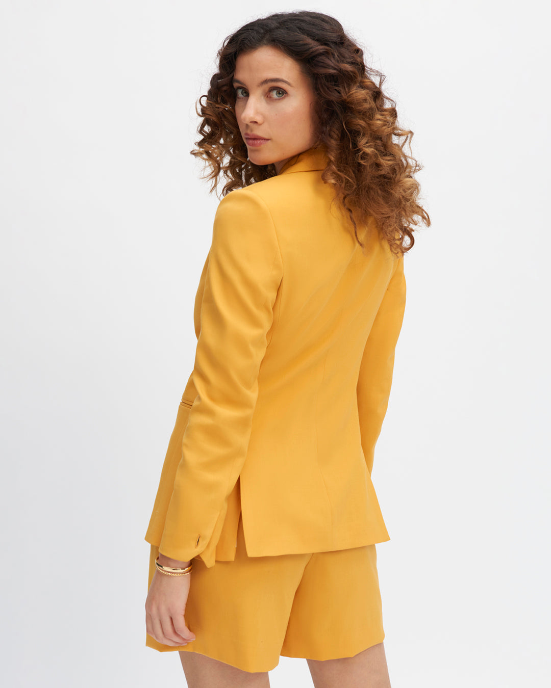 Long-sleeved jacket-yellow-cropped-and-curved-sleeved-collar-detachable-belt-toned-on-toned-two-short-slits-on-the-back-for-a-pretty-tumble